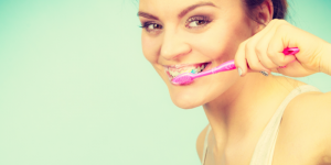 woman brushing teeth